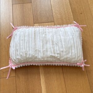 White Baby Crib Pillow with Pink Ribbon Accents